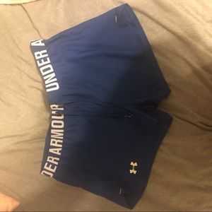 Four pairs of Under Armour running shorts